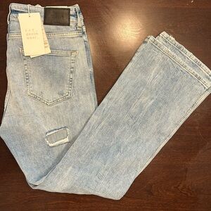 Zara Light Blue Denim Jeans with Black Leather Patch